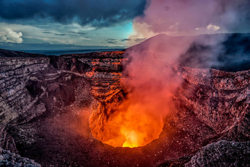 Masaya Volcano crater with burning lava and smoke - obrazy, fototapety, plakaty