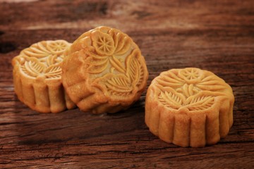 Food background concept with Mooncake on rustic wood table. Selective focus and free copy space.