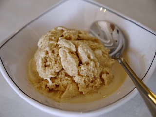 Vanilla ice cream in a bowl, top view