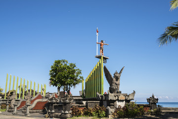 Statue of a freedom fighter on the old harbor, commemorating freedom from Dutch colonial rule in Indonesia - obrazy, fototapety, plakaty