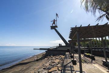 Statue of a freedom fighter on the old harbor, commemorating freedom from Dutch colonial rule in Indonesia