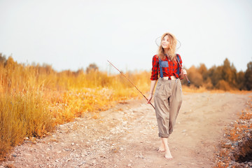 Girl with a bouquet of flowers in autumn