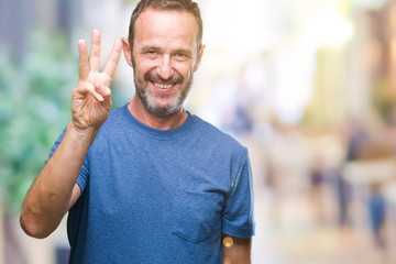 Middle age hoary senior man over isolated background showing and pointing up with fingers number...