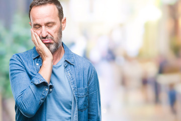 Middle age hoary senior man over isolated background thinking looking tired and bored with depression problems with crossed arms.