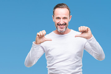 Fototapeta premium Middle age hoary senior man wearing white t-shirt over isolated background looking confident with smile on face, pointing oneself with fingers proud and happy.