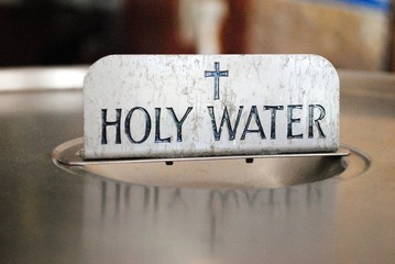 Sign for holy water in the church baptistry - obrazy, fototapety, plakaty