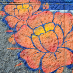Fragment of graffiti drawings. The old wall decorated with paint stains in the style of street art...