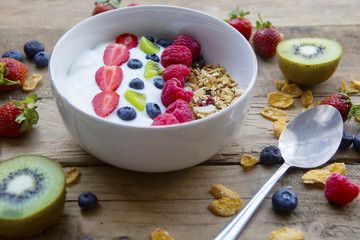 Healthy breakfast with oatmeal and fresh fruits