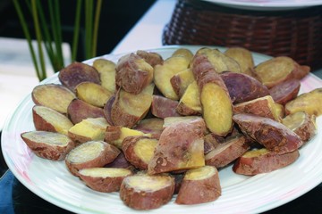 yam or sweet potato, boiled, sliced and served in a round plate