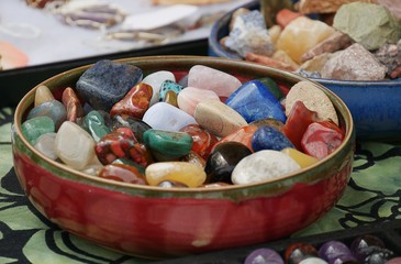 Colorful semi-precious stones and gemstones in a round bowl