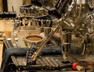 Barista working in a coffee shop, Close up of barista presses ground coffee using tamper, Barista Make Coffee Portafilter Concept
