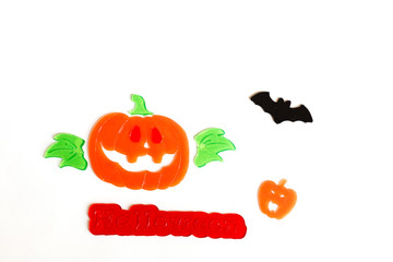 Top view of Halloween crafts, pumpkin, bat on white background with copy space for text. halloween concept. Flat lay