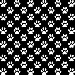 White paw prints pattern on black background illustration