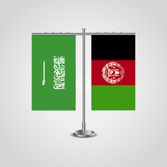 Table stand with flags of Saudi Arabia and Afghanistan.Two flag. Flag pole. Symbolizing the cooperation between the two countries. Table flags