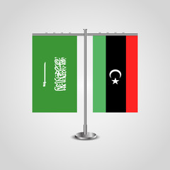 Table stand with flags of Saudi Arabia and Libya.Two flag. Flag pole. Symbolizing the cooperation between the two countries. Table flags