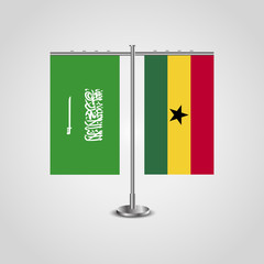 Table stand with flags of Saudi Arabia and Ghana.Two flag. Flag pole. Symbolizing the cooperation between the two countries. Table flags