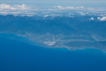 Picture of Mountains, rivers, oceans and cities taken from the plane.
