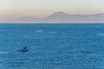 Fishing boat at sunset on the Coast of the Mediterranean at San Marco di Castellabate Italy