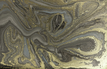 Marble abstract acrylic background. Marbling artwork texture. Agate ripple pattern. Gold powder.
