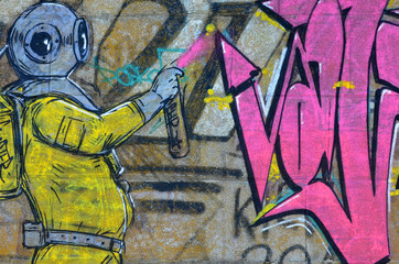 Fragment of graffiti drawings. The old wall decorated with paint stains in the style of street art culture. Scary scuba diver - obrazy, fototapety, plakaty