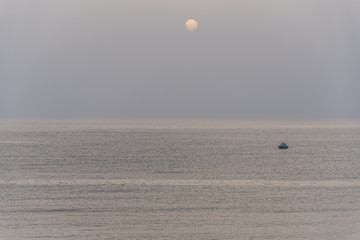 Lone Fishing Boat on the Mediterranean Sea on a grey day