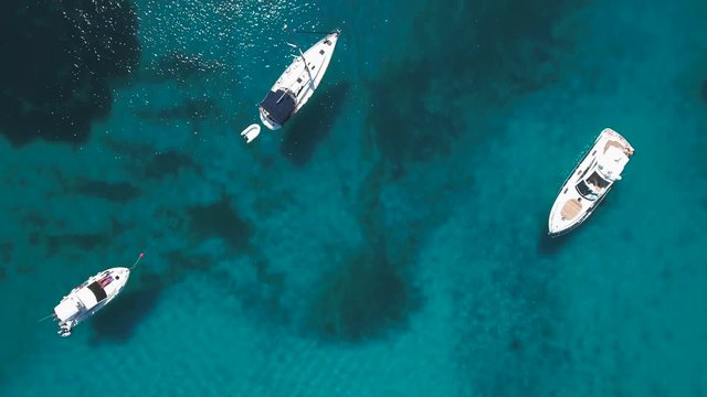 Aerial - Top down view of anchored boats in clear water of Dugi otok, Croatia
