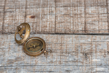 Old Antique Compass on a Wood Bench