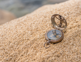 Old Antique Compass on a Rock