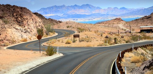 Twisting roads and intersection on the road to Hoover Dam in Boulder City, with Lake Mead in the...