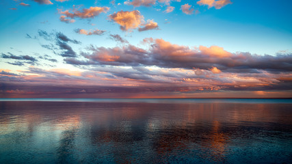 Dreamy Sunset with Clouds over Lake Superior Horizon - 224976480