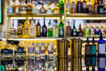 Alcoholic drink on bar counter in modern night club