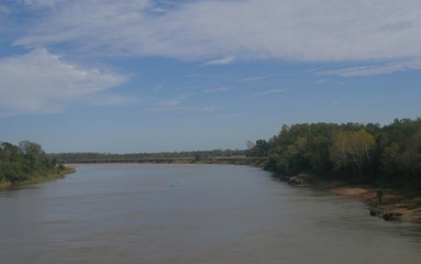  Wide shot of the Red River at the border of Oklahoma and Texas along Interstate 35. The Red River is the second largest river basin in the Great Plains forking to the Texas Panhandle and Oklahoma.