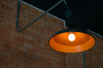 Orange ceiling lamp with LED lighting bulb