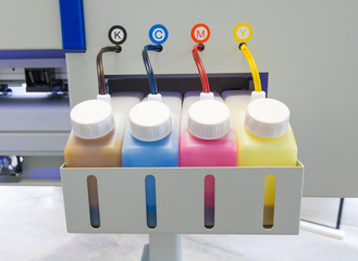 Color ink tank or large printer machine in factory for printing business.
