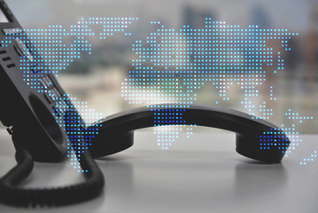 IP Phone double exposure of blue LED world map for communication concept