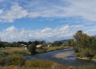 Fototapeta na wymiar Scenic countryside view of a village by the Arkansas River in Wellsville, Colorado on a beautiful day