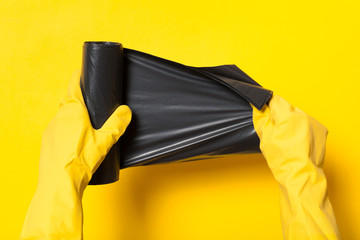 Plastic waste bag. Black garbage container roll, disposal bin.