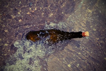 bottle with message and the wave of ocean with moving effect