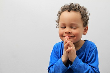little boy praying stock photo