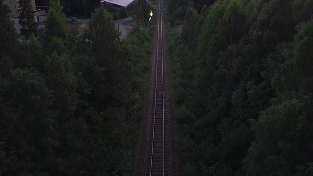 Drone shot of railway track surrounded by trees, Nurmes, Finland