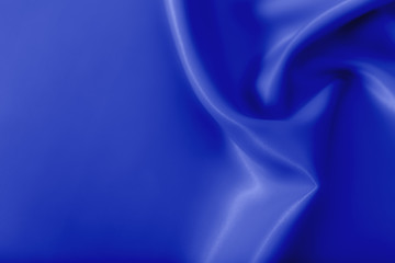 Smooth elegant blue silk or satin luxury cloth texture can use as abstract holidays background. Luxurious Christmas background or New Year background design.