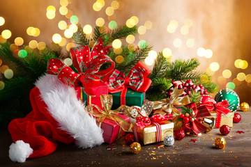  Christmas balls and gift boxes on wooden background