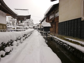 The snow covered narrow path in Japanese old town, Hida Takayama, Japan
