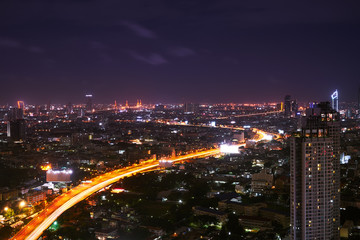 scenic of light tail in night cityscape metropolis