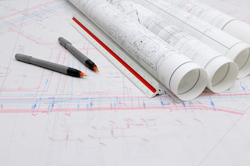 Rolled-up architectural plans and drawing tools