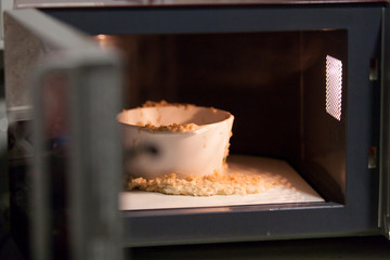 porridge crawled out of ceramic cookware in microwave oven