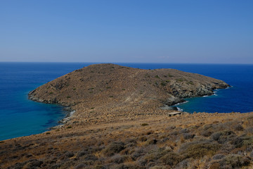 Fototapeta na wymiar Island of Syros in greece, panorama of the kliff close to Delfini beach with land and sea.