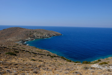 Island of Syros in greece, panorama of the kliff close to Delfini beach with land and sea.