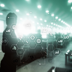 Double exposure mixed media. Diagrams and icons on hologram screen. Business people and modern city on background.