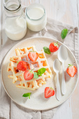 Sweet wafers with fresh strawberries and sugar